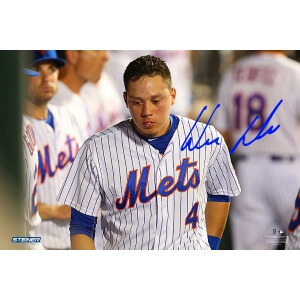 NEW YORK, NY - JULY 29:  Wilmer Flores #4 of the New York Mets looks on in the dugout in the ninth inning duirng the game against the San Diego Padres at Citi Field on July 29, 2015 in Flushing neighborhood of the Queens borough of New York City.  (Photo by Mike Stobe/Getty Images)